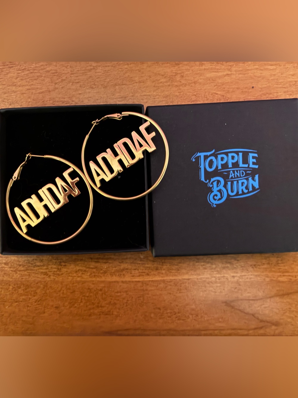 The bigger the hoops the badder the B*tch! TOPPLE AND BURN hoops
NIB